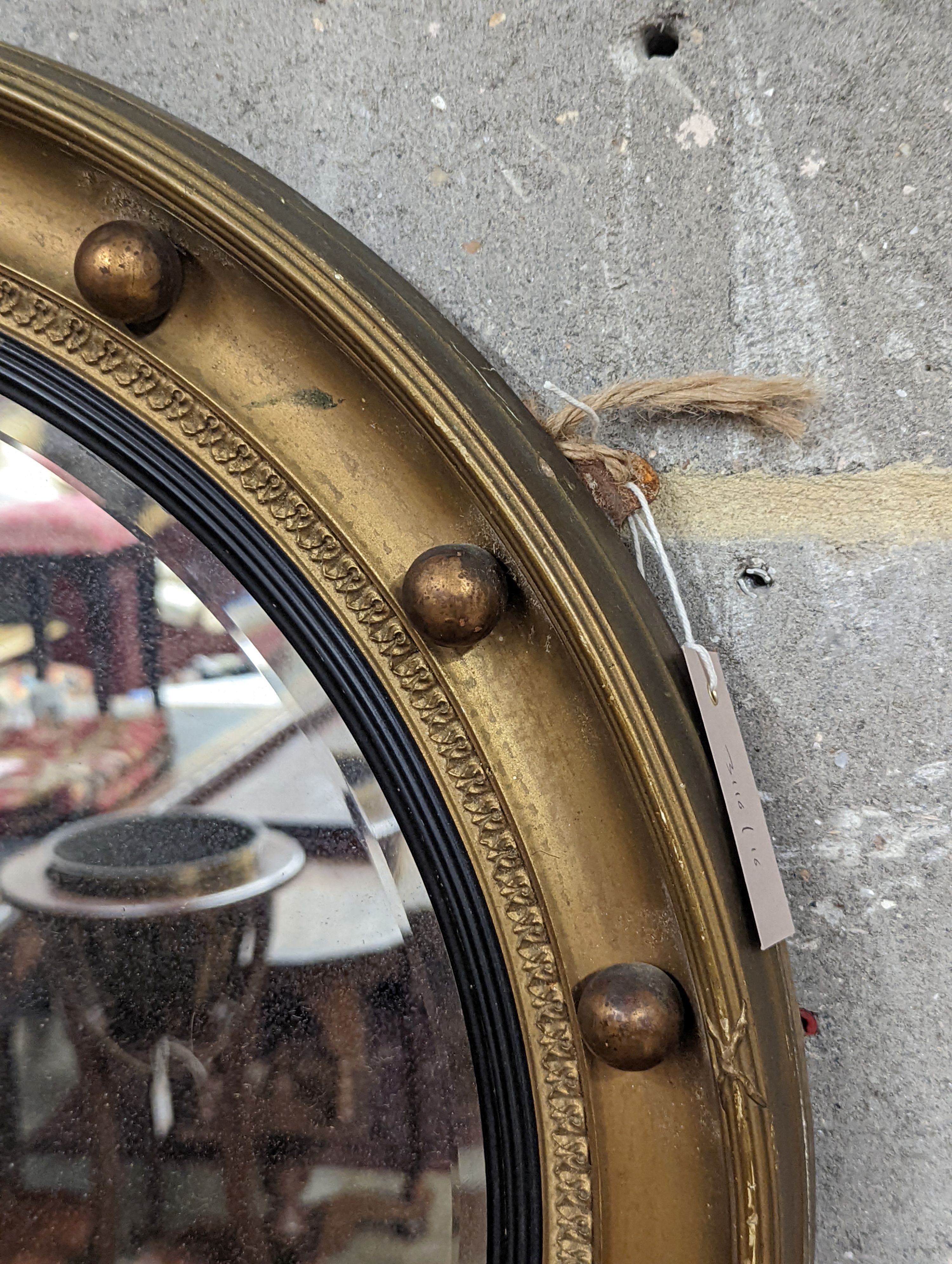 A Regency style circular gilt framed wall mirror, diameter 59cm